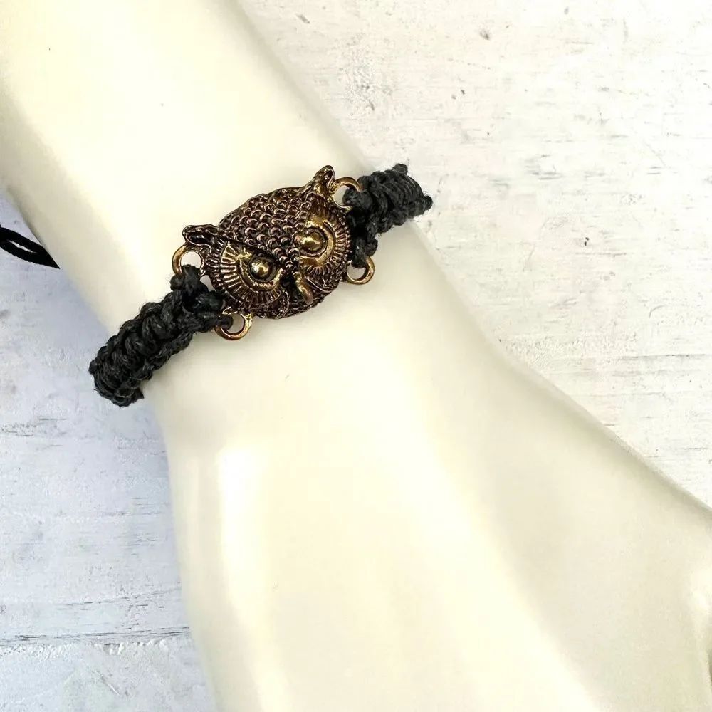 Gold tone owl black cord bracelet